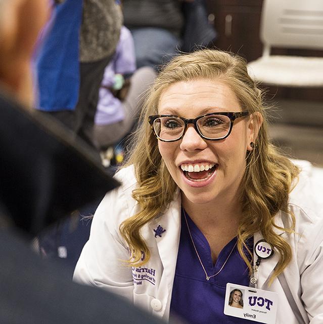 A student from the TCU nursing program engaged in community work